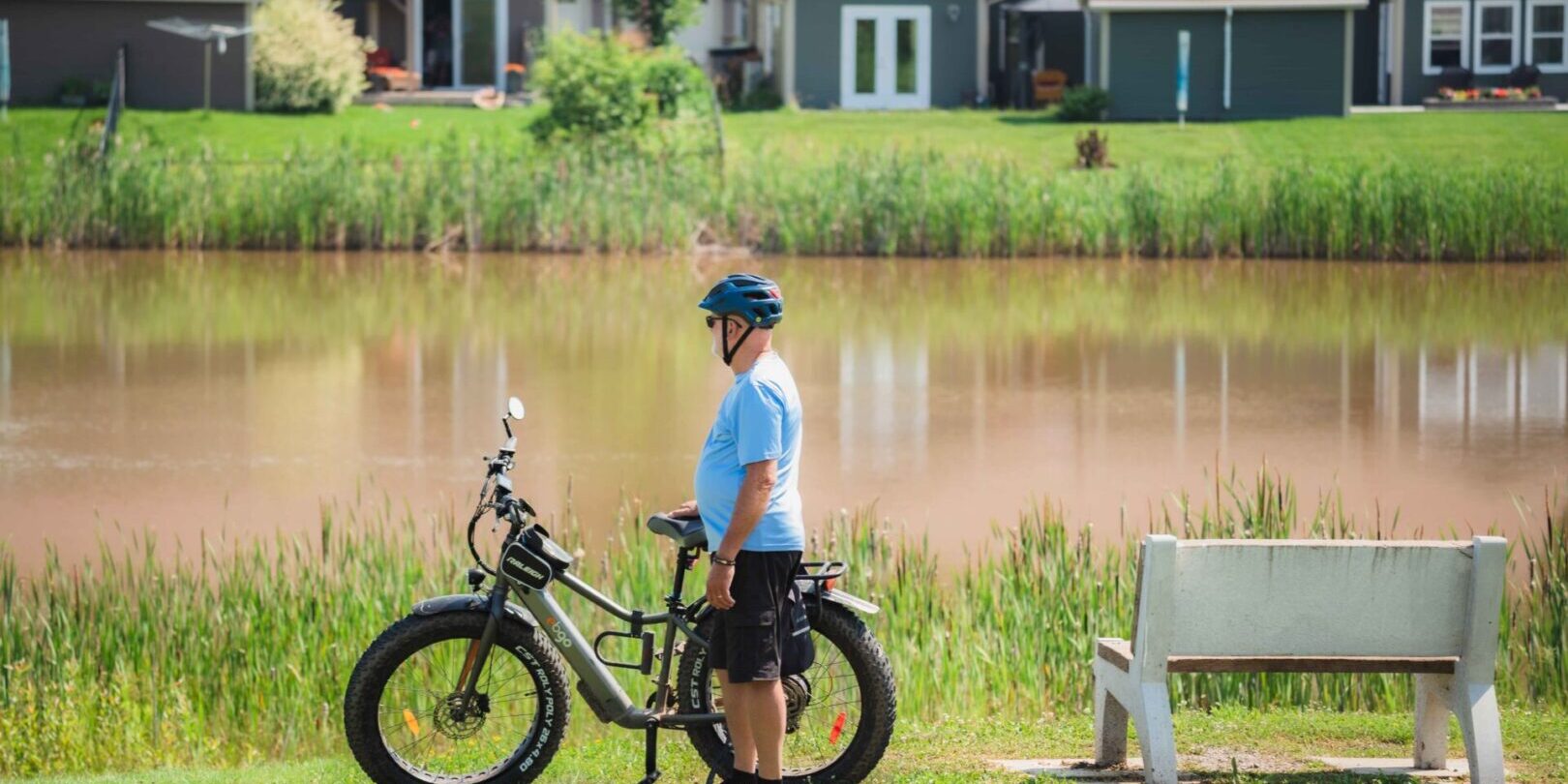 Cyclist in front of pond